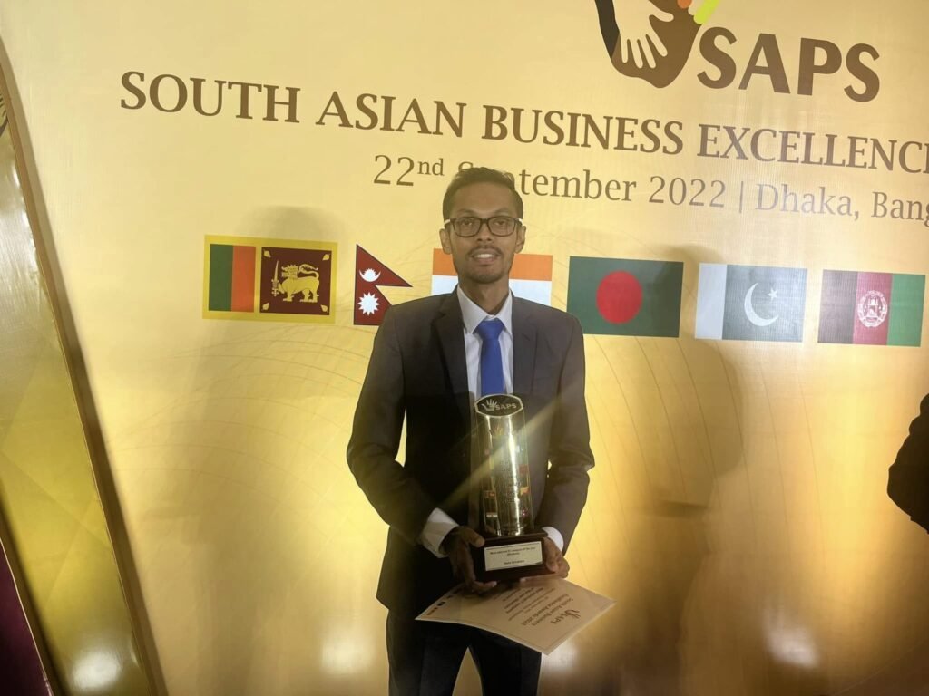 Ants Creation representative holding the South Asian Business Excellence Awards trophy in Dhaka, Bangladesh, September 2022